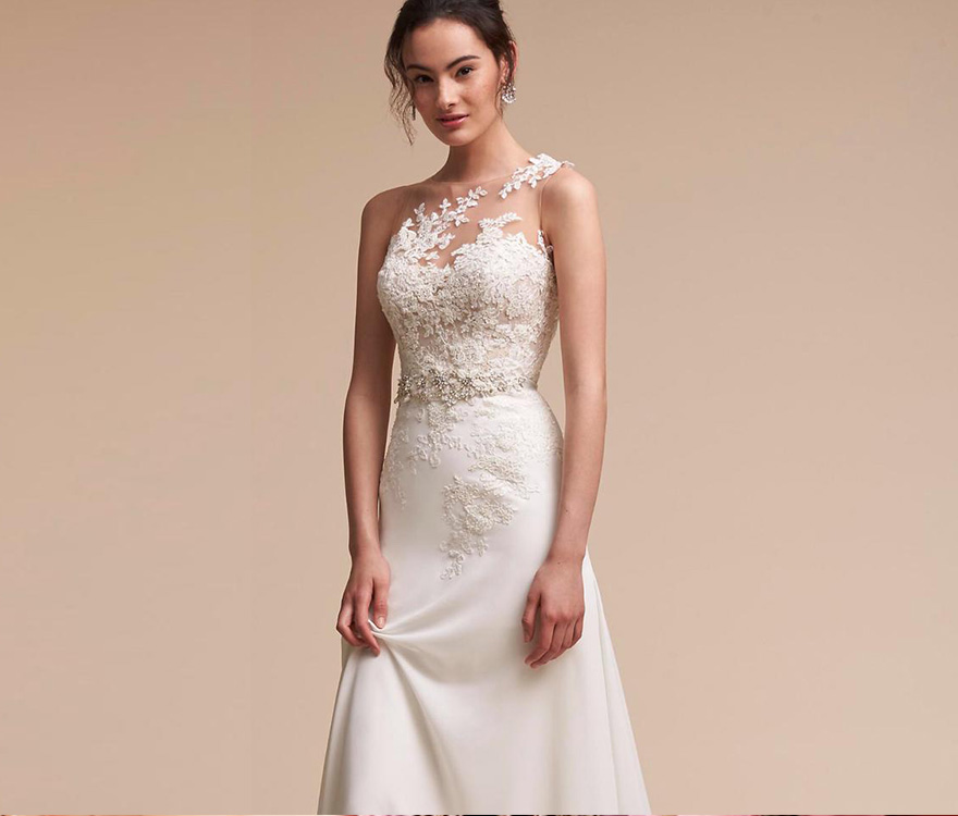 A happy model woman with a wedding hairstyle in a white lace dress runs  through the courtyard of an ancient church. Beautiful young bride holds her  Stock Photo - Alamy